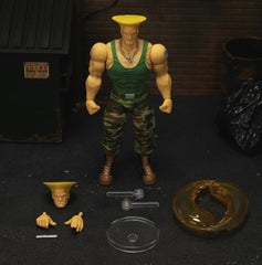 Jada Toys Street Fighter Figure Guile (15 Cm) - Personaj mobil de colecție și de acțiune din Street Fighter 2: The Final Challengers, cu cap, mâini și accesorii alternative, vârsta 13+ Action figures Naty Shop