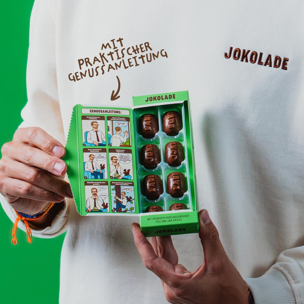 JOKOLADE PRALINE Doboz 80g | Bőséges töltelék mogyoró-nugát krémmel és chipsekkel | Fair trade csokoládé a Joko Winterscheidttől