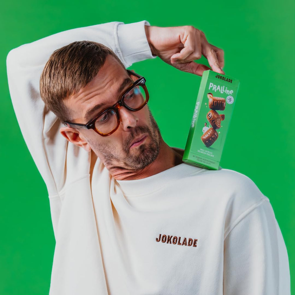 JOKOLADE PRALINE Doboz 80g | Bőséges töltelék mogyoró-nugát krémmel és chipsekkel | Fair trade csokoládé a Joko Winterscheidttől