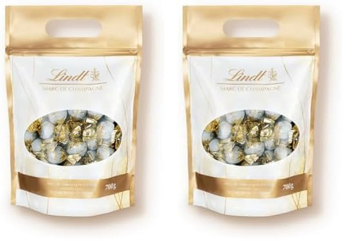 Lindt Marc de Champagne csokoládégolyók | 700 g kb. 56 db tejcsokoládé cukorka finomított töltelékkel, alkoholt tartalmaz | Tömeges csomag | Ajándék csokoládé | Csokoládé ajándék