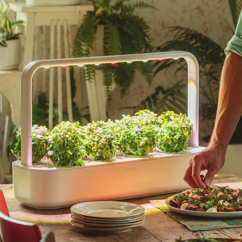 Grădină interioară Click and Grow, mai ușoară decât un sistem de creștere hidroponic, Grădină inteligentă cu LED, grădină de plante aromatice, seră interioară cu 9 capsule de plante incluse (alb)
